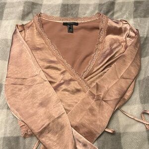 Cropped peach colored satin sleeping shirt from Forever 21.